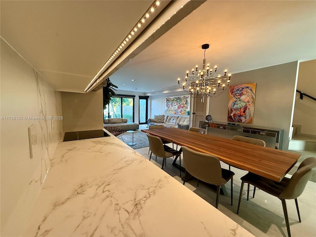 dining area featuring an inviting chandelier