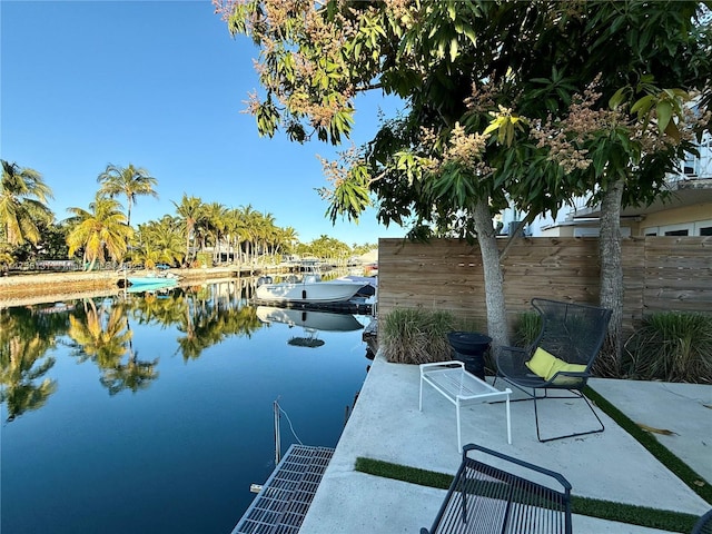 view of patio / terrace with a dock and a water view