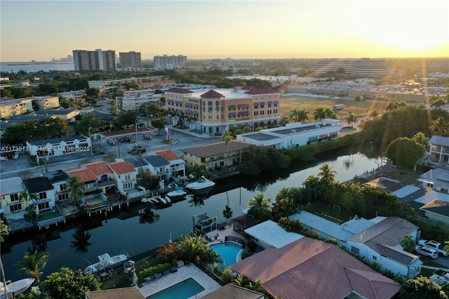 aerial view at dusk with a water view