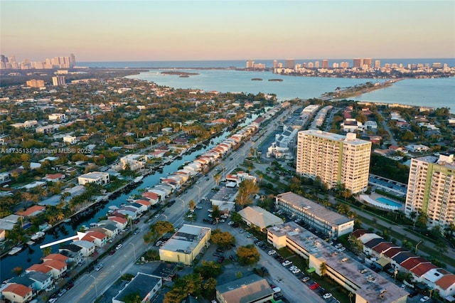 aerial view at dusk with a water view