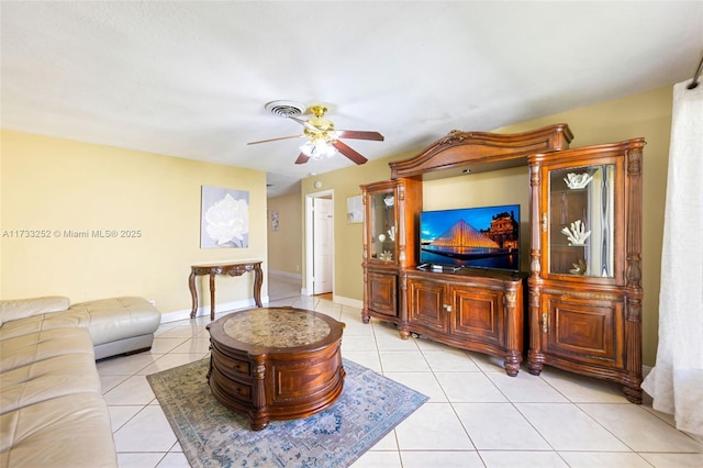 living room with ceiling fan and light tile patterned floors