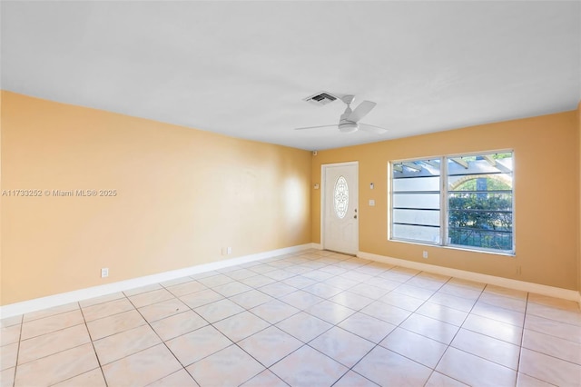 tiled entrance foyer featuring ceiling fan