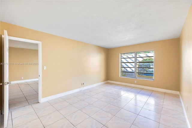 empty room featuring light tile patterned floors