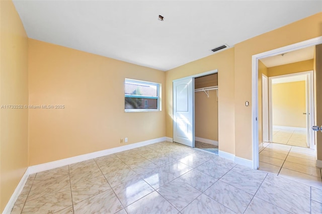 unfurnished bedroom with a closet