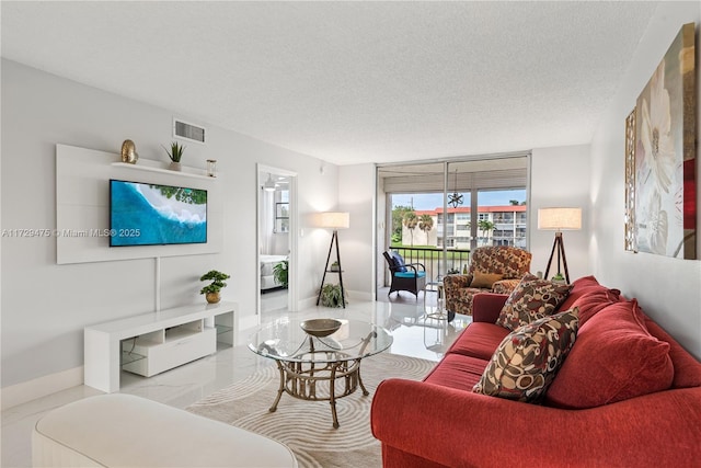 living room with a textured ceiling