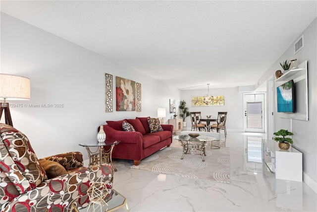 living room featuring a healthy amount of sunlight and a textured ceiling