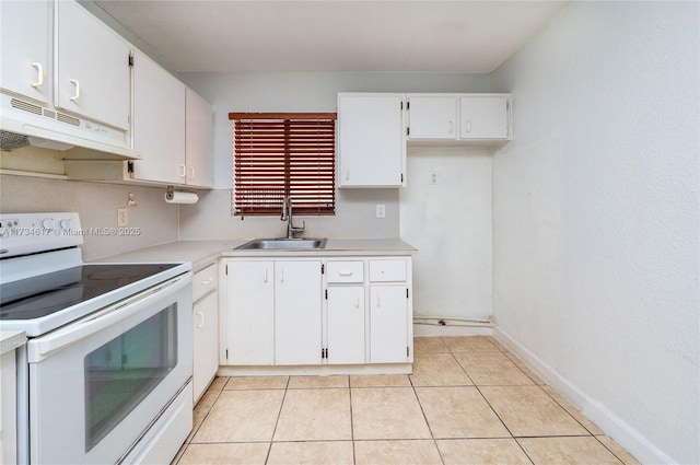 kitchen featuring light tile patterned flooring, sink, white electric range, and white cabinets