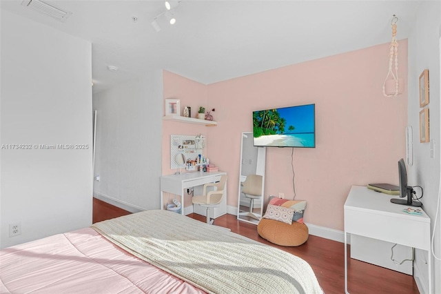 bedroom featuring dark wood-type flooring