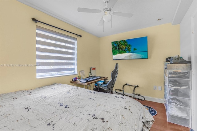 bedroom with wood-type flooring and ceiling fan