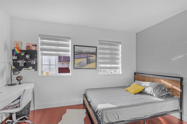 bedroom featuring hardwood / wood-style flooring