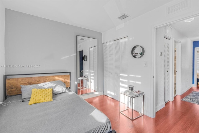 bedroom with wood-type flooring