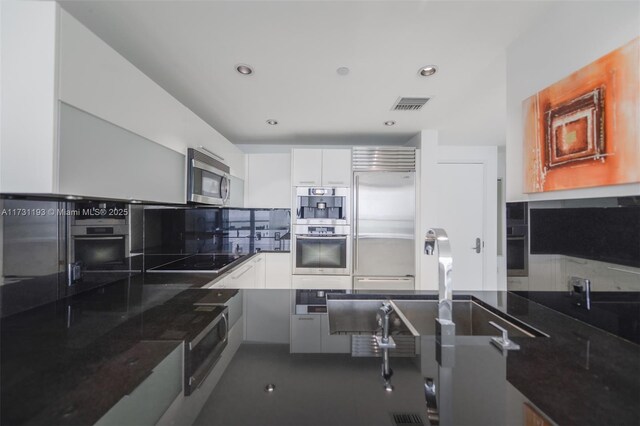 tiled dining space featuring sink