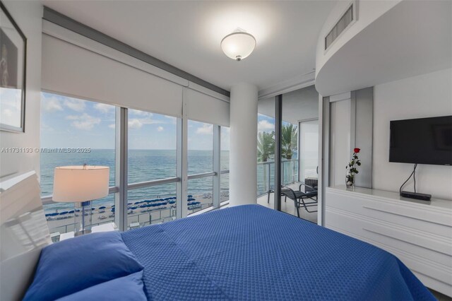 bedroom featuring a wall of windows