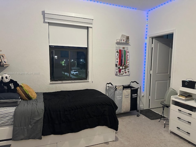 bedroom with light colored carpet