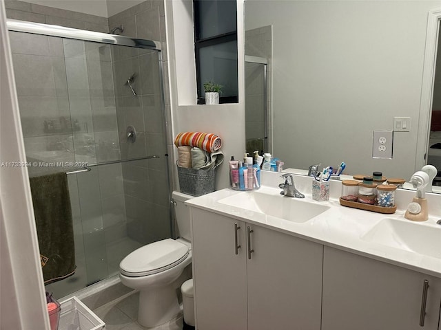 full bath with tile patterned floors, a shower stall, toilet, and vanity