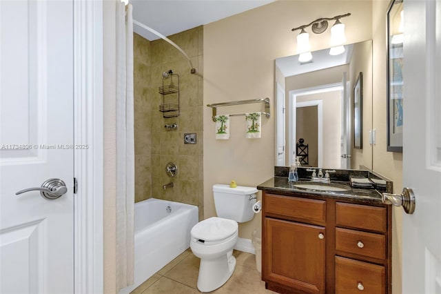 full bathroom featuring tile patterned floors, toilet, tiled shower / bath combo, and vanity