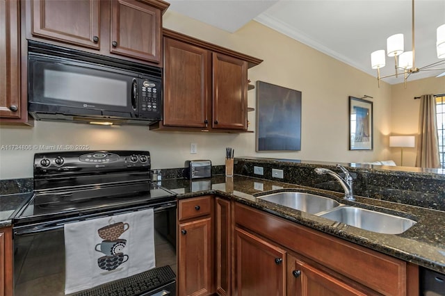 kitchen with hanging light fixtures, sink, dark stone counters, and black appliances