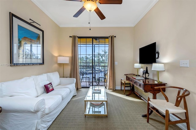 living room with ornamental molding and ceiling fan