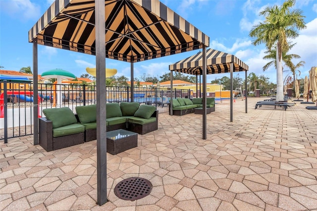 view of patio with a playground, a gazebo, and outdoor lounge area