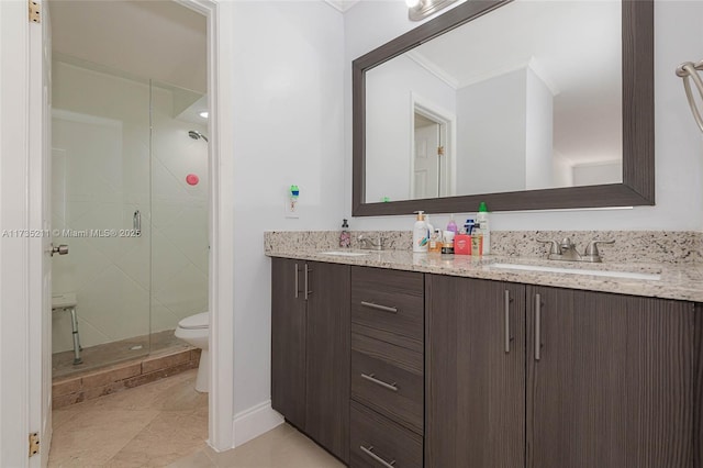 bathroom featuring tile patterned flooring, vanity, ornamental molding, an enclosed shower, and toilet