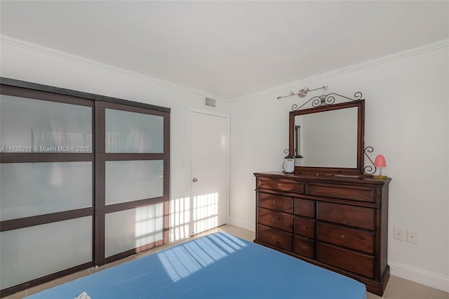 bedroom with ornamental molding