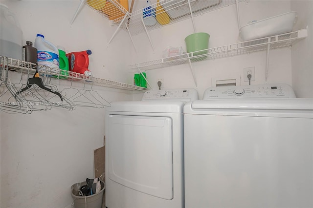 laundry area featuring washing machine and clothes dryer