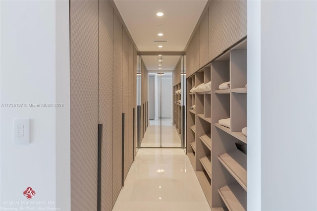 hallway with light tile patterned floors