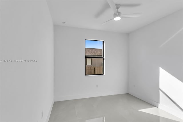 spare room with ceiling fan