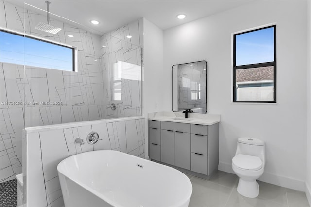 full bathroom featuring vanity, tile walls, shower with separate bathtub, and toilet