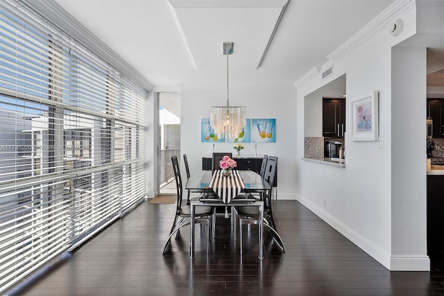 dining room with floor to ceiling windows, ornamental molding, dark wood-type flooring, and a chandelier