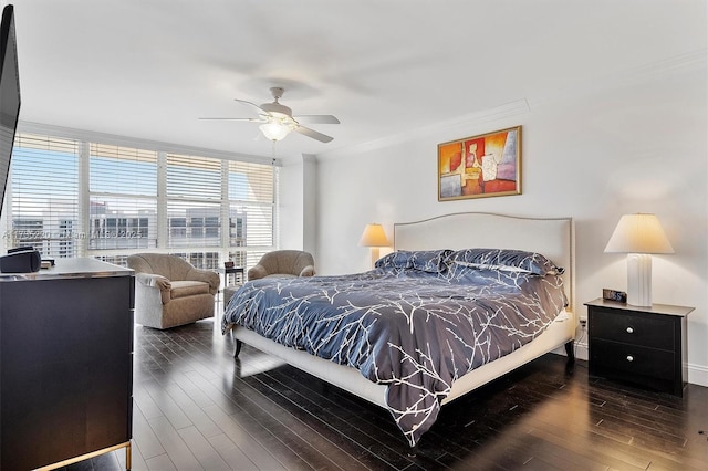 bedroom featuring dark hardwood / wood-style flooring, ornamental molding, floor to ceiling windows, and ceiling fan