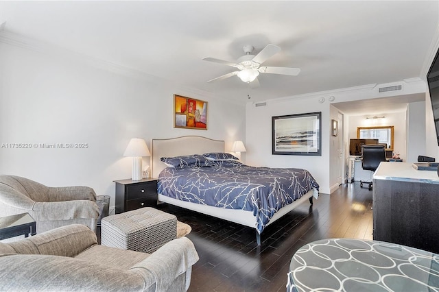 bedroom with crown molding, dark hardwood / wood-style floors, and ceiling fan