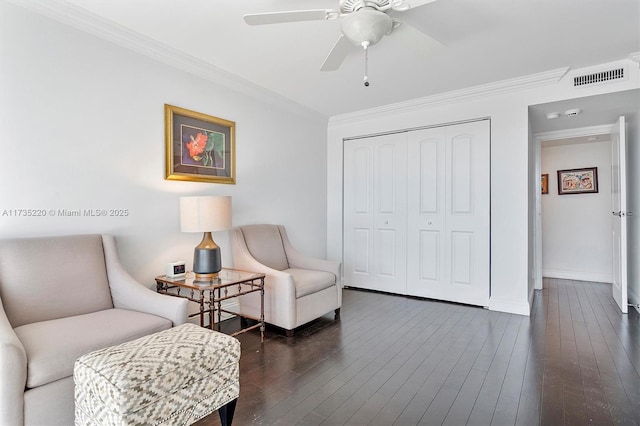800 Parkview Dr Unit 1014, Hallandale Beach, FL 33009 - living area featuring crown molding, a ceiling fan, baseboards, dark wood-type flooring, and visible vents