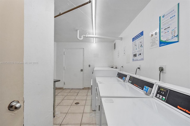 800 Parkview Dr Unit 1014, Hallandale Beach, FL 33009 - community laundry room with light tile patterned floors and washing machine and clothes dryer