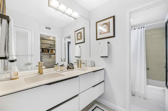 kitchen with white cabinetry, sink, backsplash, and stainless steel appliances