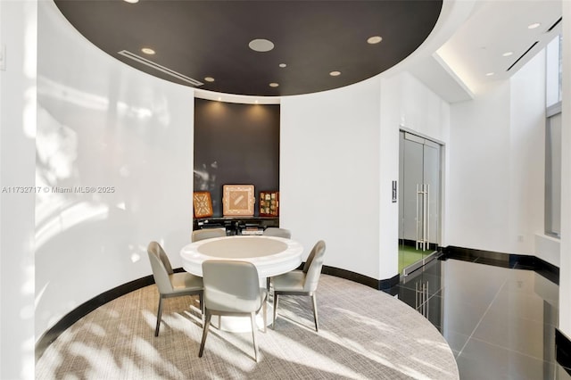 dining room with tile patterned flooring