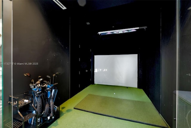 game room with golf simulator