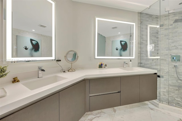 bathroom featuring a shower with door and vanity