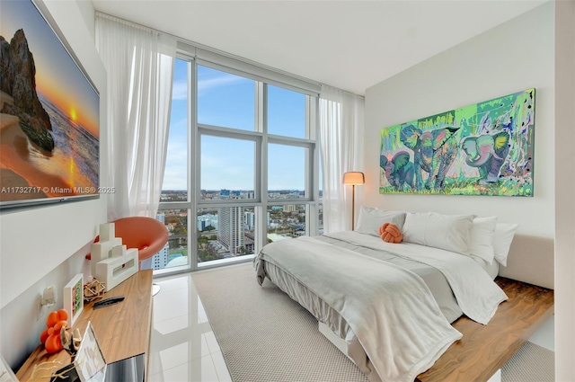 bedroom featuring a wall of windows