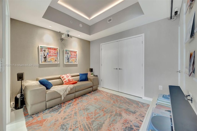 living room featuring a tray ceiling