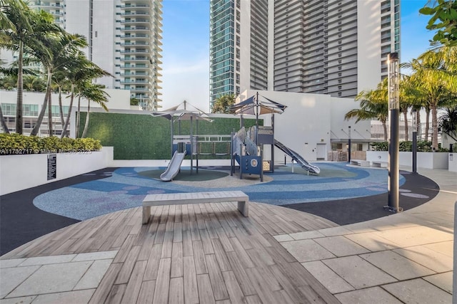 view of pool featuring a playground