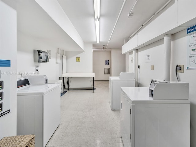 clothes washing area featuring washing machine and clothes dryer