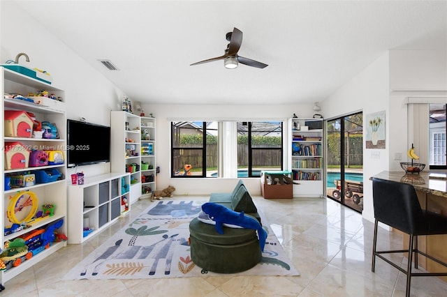 living room with lofted ceiling and ceiling fan