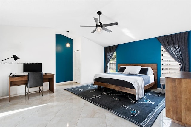 bedroom featuring ceiling fan and lofted ceiling