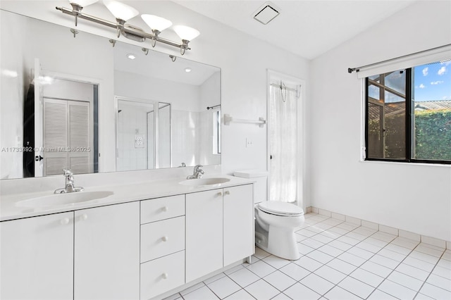 bathroom featuring tile patterned floors, toilet, an enclosed shower, and vanity