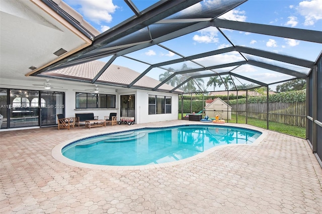 view of pool featuring a patio, a lanai, and ceiling fan