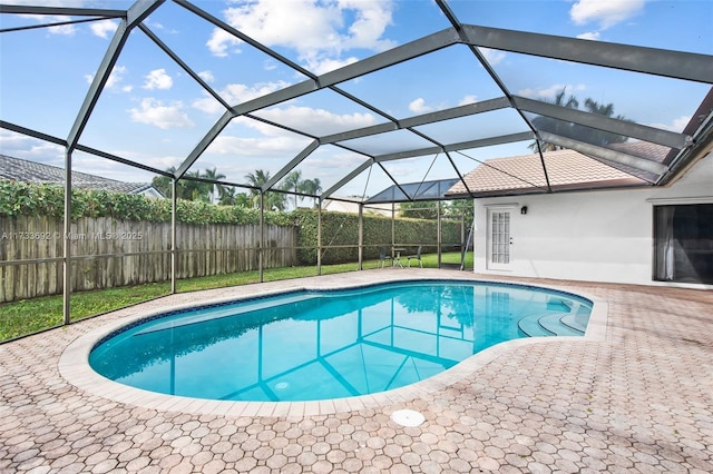 view of pool with a lanai and a patio area