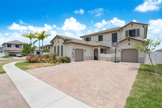 mediterranean / spanish home featuring a garage