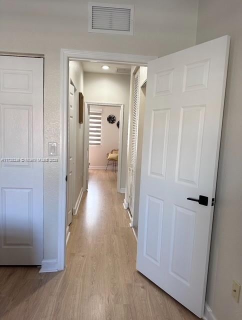 hall featuring light hardwood / wood-style flooring