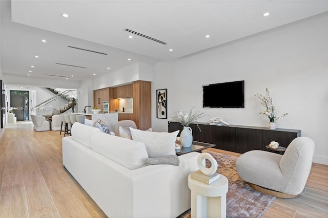 living room with light hardwood / wood-style floors